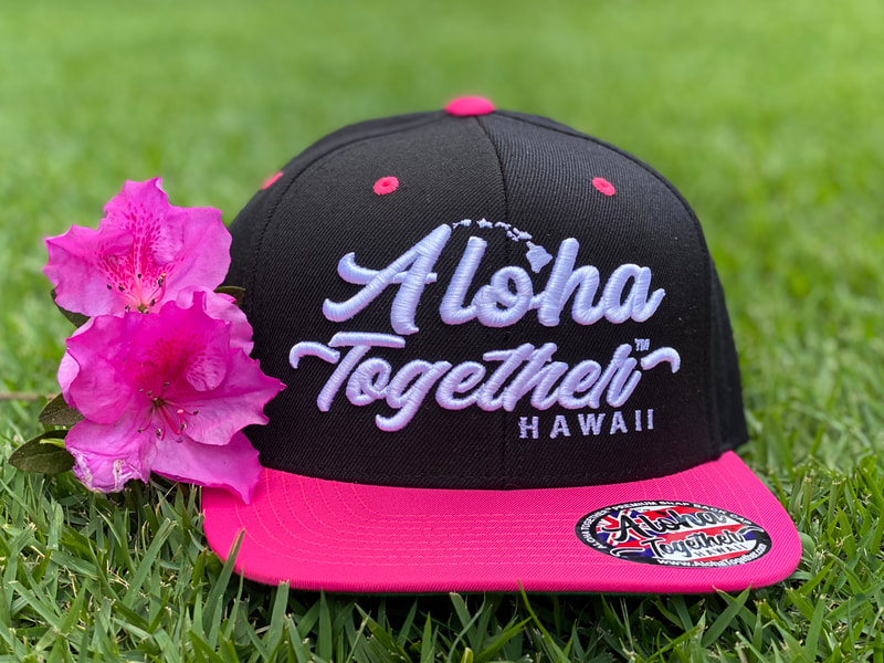Pink Aloha Together hat with a pink flower.